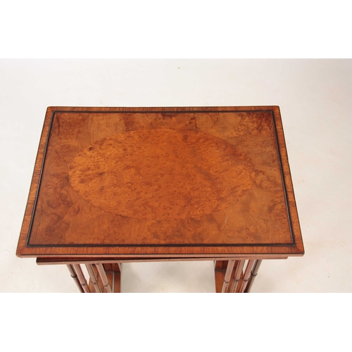 1000 - AN EARLY 20TH CENTURY AMBOYNA AND BURR WALNUT NEST OF TABLES having four graduated tables standing o... 