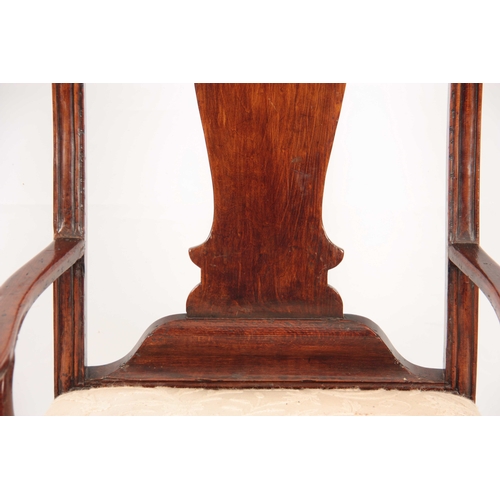 1001 - A GEO II STAINED BEECH GENTLEMANS IRISH OPEN ARMCHAIR with shaped top rail having carved shell above... 