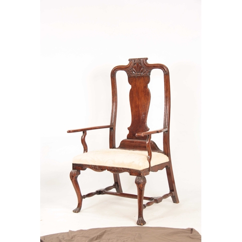 1001 - A GEO II STAINED BEECH GENTLEMANS IRISH OPEN ARMCHAIR with shaped top rail having carved shell above... 