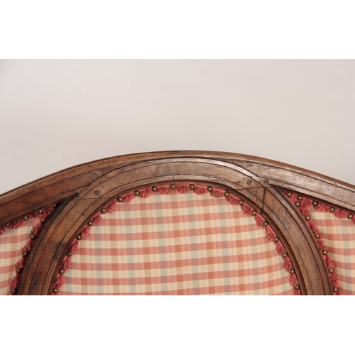 1003 - AN 18TH CENTURY WALNUT ITALIAN THREE SEATER SETTEE OF SHAPED SERPENTINE FORM having a panelled raise... 