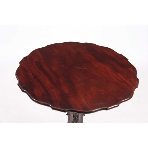 1004 - A FINE GEORGE III FIGURED MAHOGANY CHIPPENDALE STYLE TILT TOP TABLE with solid shaped edge hinged to... 