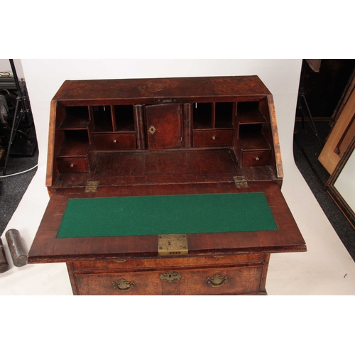 1005 - AN EARLY 18TH CENTURY QUEEN ANNE WALNUT BUREAU HAVING SUPERB ORIGINAL COLOUR AND PATINA the hinged a... 