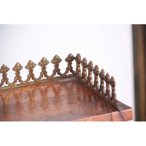 1006 - A REGENCY BURR ELM LIBRARY CABINET IN THE MANOR OF GEORGE BULLOCK with raised superstructure having ... 