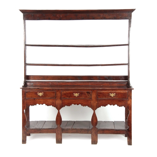 1007 - AN EARLY 18TH CENTURY JOINED OAK SILHOUETTE POT BOARD DRESSER AND RACK with moulded cornice above tw... 