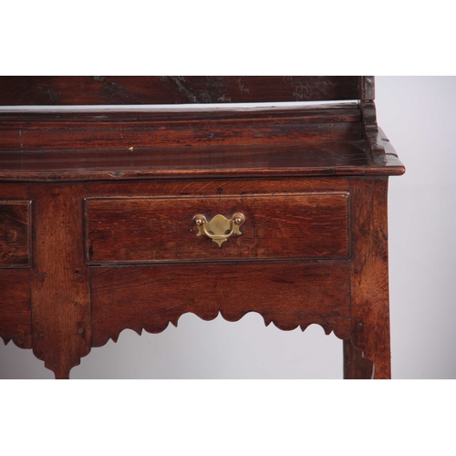 1007 - AN EARLY 18TH CENTURY JOINED OAK SILHOUETTE POT BOARD DRESSER AND RACK with moulded cornice above tw... 