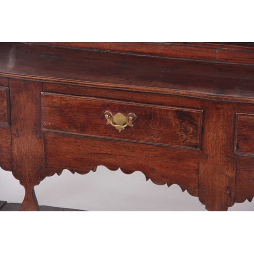 1007 - AN EARLY 18TH CENTURY JOINED OAK SILHOUETTE POT BOARD DRESSER AND RACK with moulded cornice above tw... 