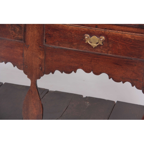 1007 - AN EARLY 18TH CENTURY JOINED OAK SILHOUETTE POT BOARD DRESSER AND RACK with moulded cornice above tw... 