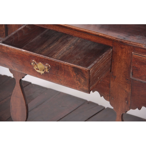 1007 - AN EARLY 18TH CENTURY JOINED OAK SILHOUETTE POT BOARD DRESSER AND RACK with moulded cornice above tw... 