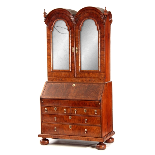 1008 - A WILLIAM AND MARY HERRING-BANDED AND FIGURED WALNUT BUREAU BOOKCASE the double-domed top with origi... 