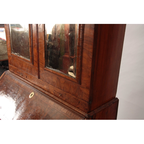 1008 - A WILLIAM AND MARY HERRING-BANDED AND FIGURED WALNUT BUREAU BOOKCASE the double-domed top with origi... 