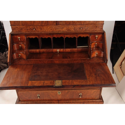 1008 - A WILLIAM AND MARY HERRING-BANDED AND FIGURED WALNUT BUREAU BOOKCASE the double-domed top with origi... 