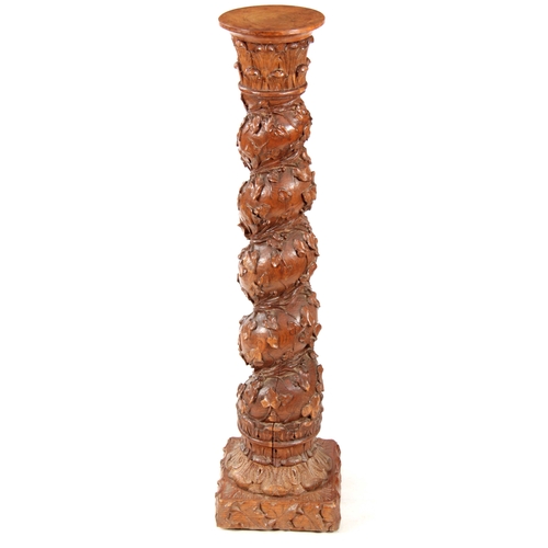 1009 - A 19TH CENTURY CARVED OAK BARLEY TWIST COLUMN with ivy vines and floral carved base 113cm high.