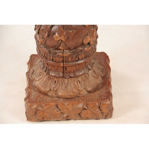 1009 - A 19TH CENTURY CARVED OAK BARLEY TWIST COLUMN with ivy vines and floral carved base 113cm high.