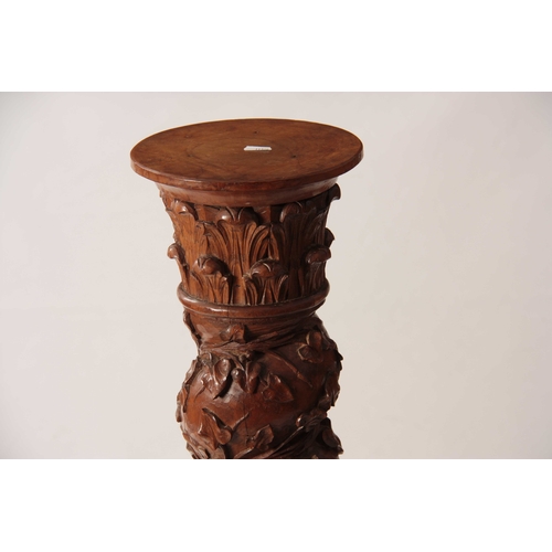 1009 - A 19TH CENTURY CARVED OAK BARLEY TWIST COLUMN with ivy vines and floral carved base 113cm high.