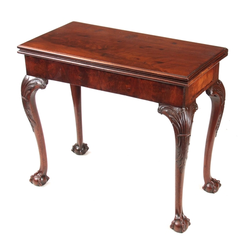 1012 - A MID 18TH CENTURY IRISH MAHOGANY FOLD OVER CARD TABLE the green baize lined playing surface with a ... 