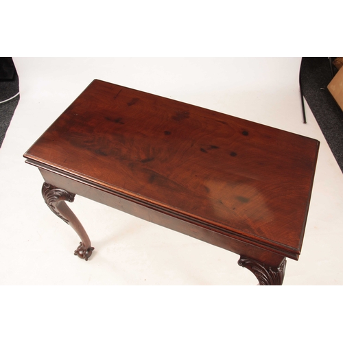 1012 - A MID 18TH CENTURY IRISH MAHOGANY FOLD OVER CARD TABLE the green baize lined playing surface with a ... 