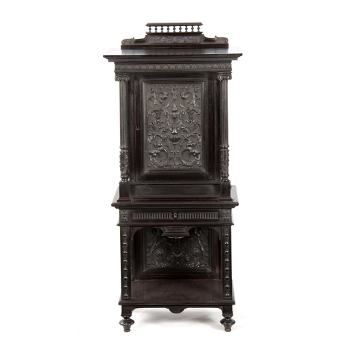 1018 - AN UNUSUAL 19TH CENTURY FRENCH EBONISED COLLECTORS CABINET with finely carved columns and hinged doo... 