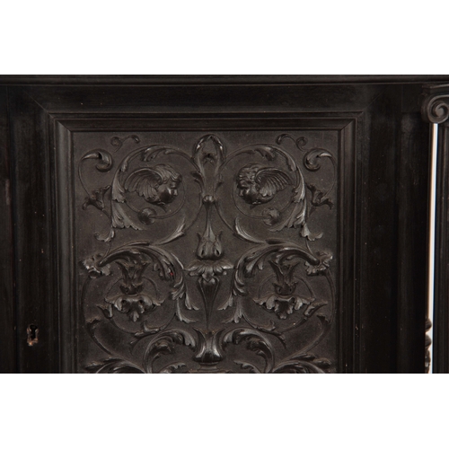 1018 - AN UNUSUAL 19TH CENTURY FRENCH EBONISED COLLECTORS CABINET with finely carved columns and hinged doo... 