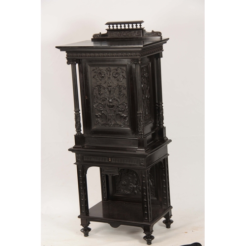 1018 - AN UNUSUAL 19TH CENTURY FRENCH EBONISED COLLECTORS CABINET with finely carved columns and hinged doo... 