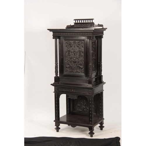 1018 - AN UNUSUAL 19TH CENTURY FRENCH EBONISED COLLECTORS CABINET with finely carved columns and hinged doo... 