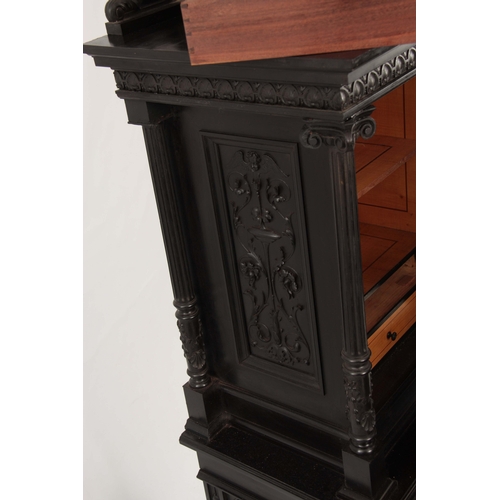 1018 - AN UNUSUAL 19TH CENTURY FRENCH EBONISED COLLECTORS CABINET with finely carved columns and hinged doo... 