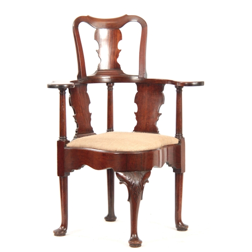 1019 - A GOOD GEORGE II MAHOGANY CORNER CHAIR with shaped raised back and fret cut vase-shaped splats, wide... 