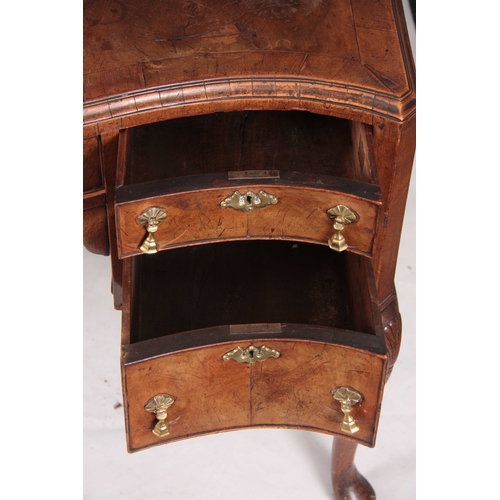 1025 - A 19TH CENTURY QUEEN ANNE STYLE FIGURED WALNUT SERPENTINE FRONTED DESK with a short-grained moulded ... 