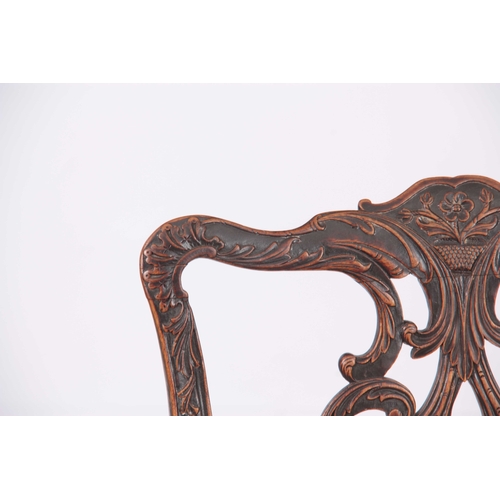 1028 - A PAIR OF GEORGE III CHIPPENDALE STYLE SIDE CHAIRS with elaborate pierced leaf carved backs, upholst... 