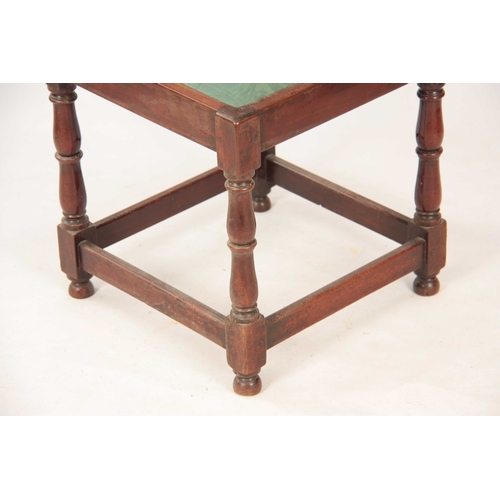 1031 - A GEORGE II WALNUT CORNER CHAIR with shaped back having pierced back splats raised by turned support... 