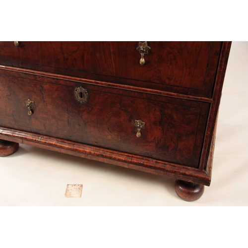 1034 - A WILLIAM AND MARY FIGURED WALNUT CHEST OF DRAWERS with quarter veneered top above two small and two... 