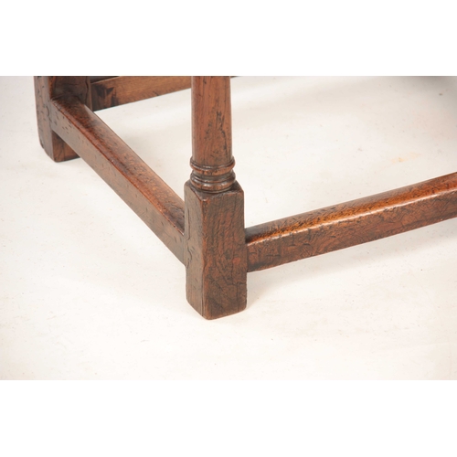 1038 - A RARE LATE 17TH CENTURY OAK UPHOLSTERED JOINT STOOL with tapestry top; standing on ring turned supp... 