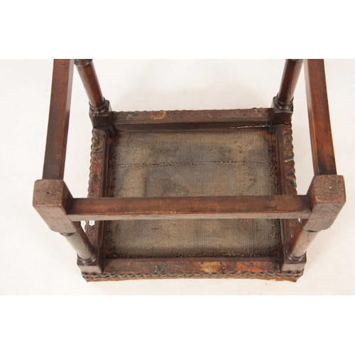 1038 - A RARE LATE 17TH CENTURY OAK UPHOLSTERED JOINT STOOL with tapestry top; standing on ring turned supp... 