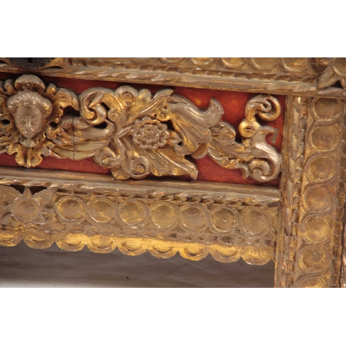 1041 - AN 18TH CENTURY ITALIAN CARVED GILTWOOD COFFER with baroque style carved front, above an iron strapp... 