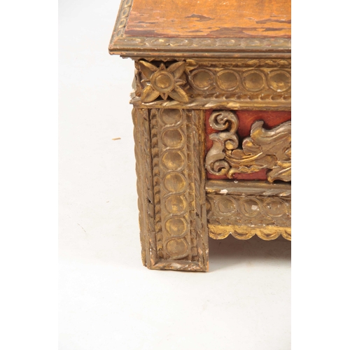 1041 - AN 18TH CENTURY ITALIAN CARVED GILTWOOD COFFER with baroque style carved front, above an iron strapp... 