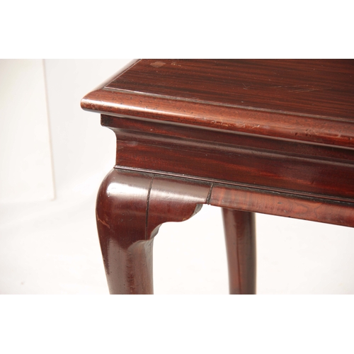 1043 - A GEORGE II IRISH MAHOGANY CONSOLE TABLE with shaped shallow frieze; standing on bulbous shaped cabr... 