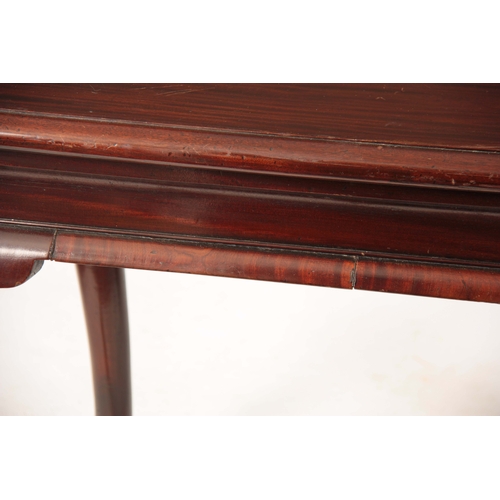 1043 - A GEORGE II IRISH MAHOGANY CONSOLE TABLE with shaped shallow frieze; standing on bulbous shaped cabr... 