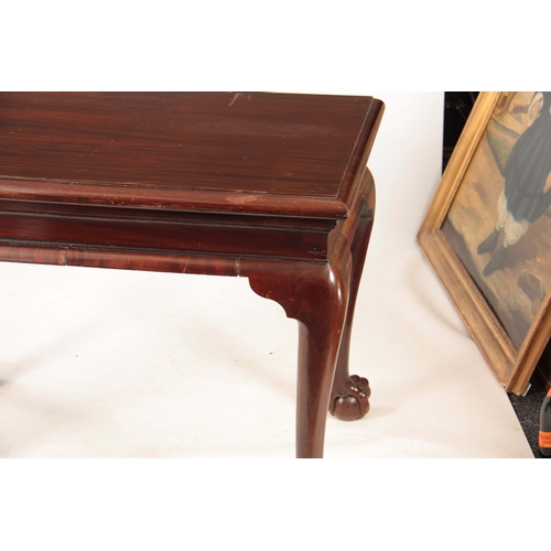 1043 - A GEORGE II IRISH MAHOGANY CONSOLE TABLE with shaped shallow frieze; standing on bulbous shaped cabr... 