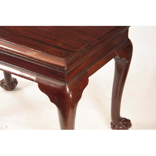 1043 - A GEORGE II IRISH MAHOGANY CONSOLE TABLE with shaped shallow frieze; standing on bulbous shaped cabr... 