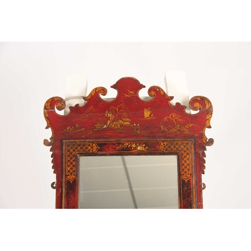 1047 - A GEORGE III RED LAQUER CHINOUSERUIRE HANGING WALL MIRROR with shaped fret cut corners surrounding a... 