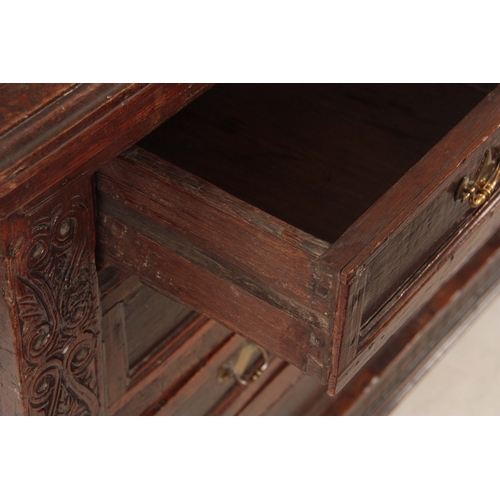 1051 - AN UNUSUAL  LATE 17TH CENTURY JOINED OAK CHEST OF DRAWERS WITH LIFT UP LID the hinged moulded edge t... 