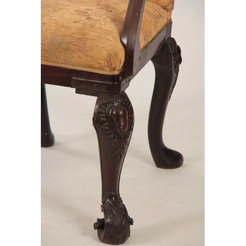 1053 - AN UNUSUAL GEORGE II MAHOGANY ARMCHAIR with angled shaped back and sweeping open arms; standing on c... 