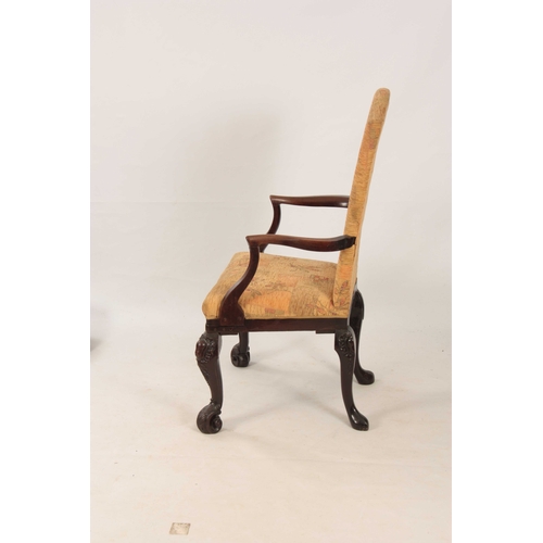 1053 - AN UNUSUAL GEORGE II MAHOGANY ARMCHAIR with angled shaped back and sweeping open arms; standing on c... 