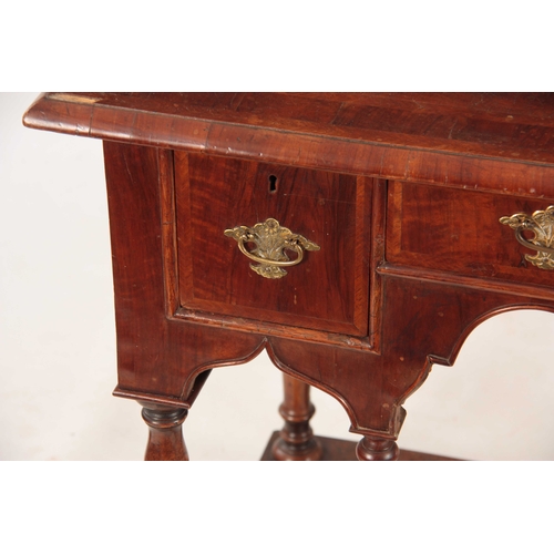 1057 - A WILLIAM AND MARY HERRING-BANDED FIGURED WALNUT SIDE TABLE with a quarter veneered cross-banded top... 