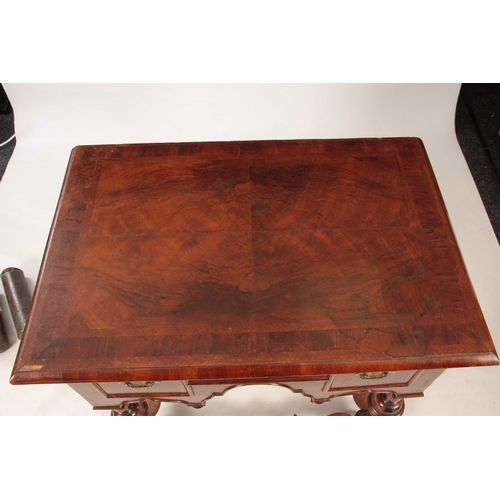 1057 - A WILLIAM AND MARY HERRING-BANDED FIGURED WALNUT SIDE TABLE with a quarter veneered cross-banded top... 