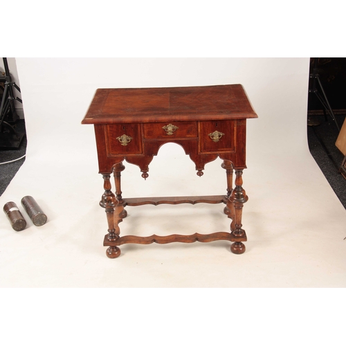 1057 - A WILLIAM AND MARY HERRING-BANDED FIGURED WALNUT SIDE TABLE with a quarter veneered cross-banded top... 