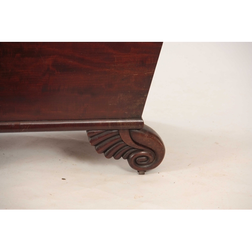 1058 - A WILLIAM IV MAHOGANY WINE COOLER with rounded moulded edge above tapering sides; mounted on leaf ca... 