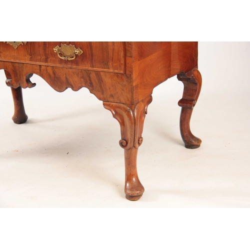 1069 - AN UNUSUAL QUEEN ANNE FIGURED WALNUT BUREAU BOOKCASE top mirrored door flanked by tapering reeded co... 