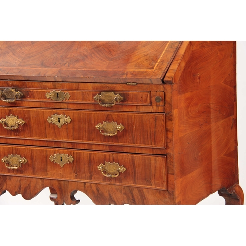 1069 - AN UNUSUAL QUEEN ANNE FIGURED WALNUT BUREAU BOOKCASE top mirrored door flanked by tapering reeded co... 