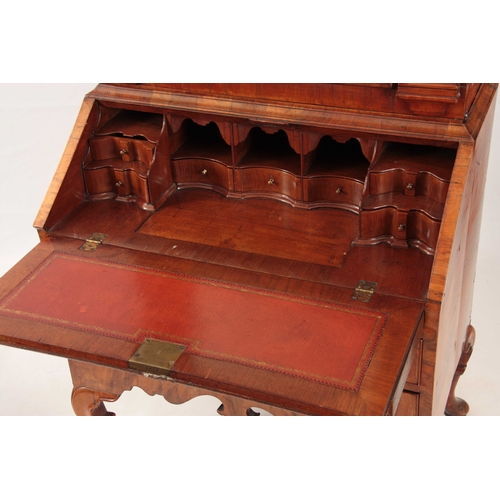 1069 - AN UNUSUAL QUEEN ANNE FIGURED WALNUT BUREAU BOOKCASE top mirrored door flanked by tapering reeded co... 