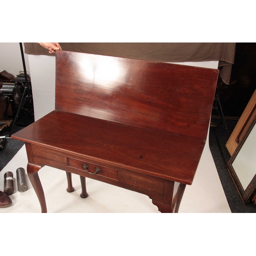 1070 - A GEORGE III MAHOGANY OVERSIZED COUNTRY HOUSE TEA TABLE with fold-over top above a central frieze dr... 